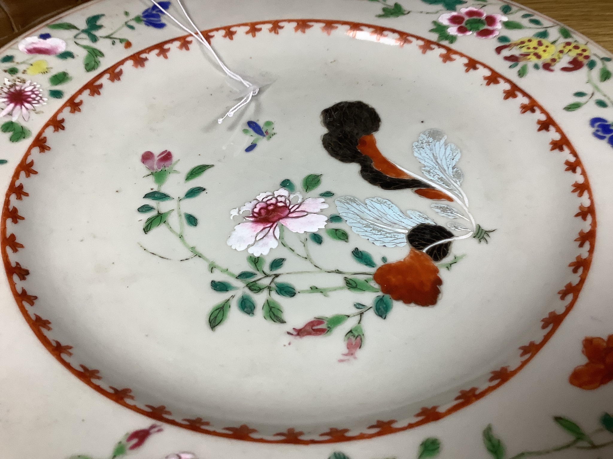 An 18th century Chinese export porcelain ‘tobacco leaf’ plate, painted in famille rose enamels, 27cm